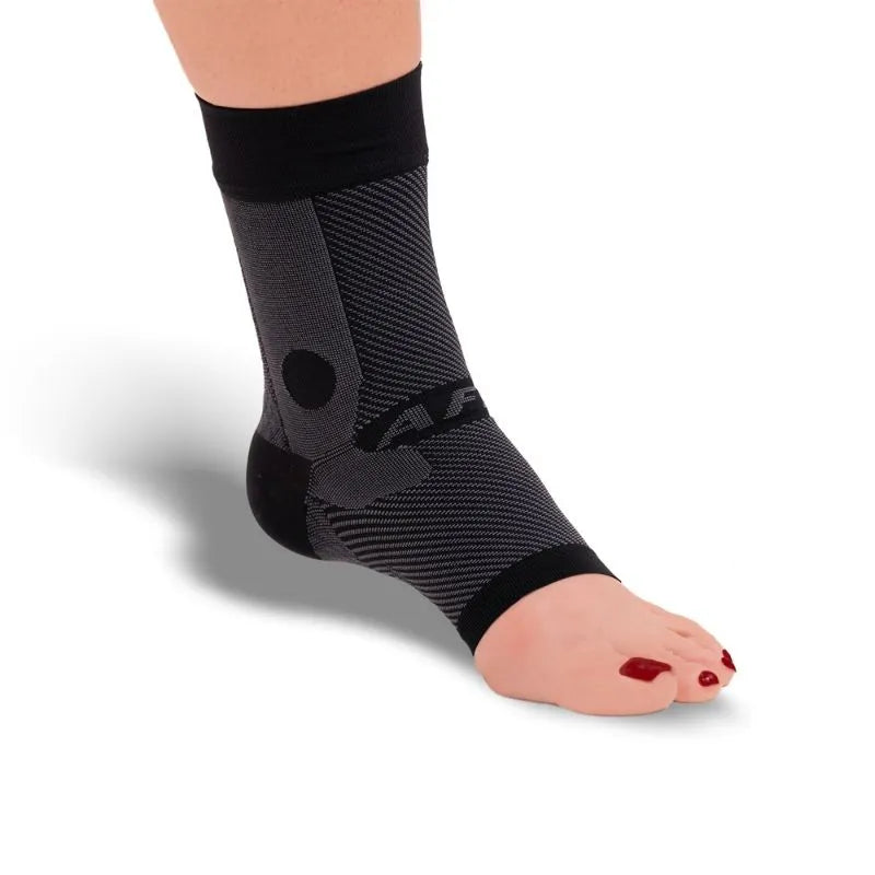 The black OrthoSleeve AF7 Compression Ankle Brace shown on a foot