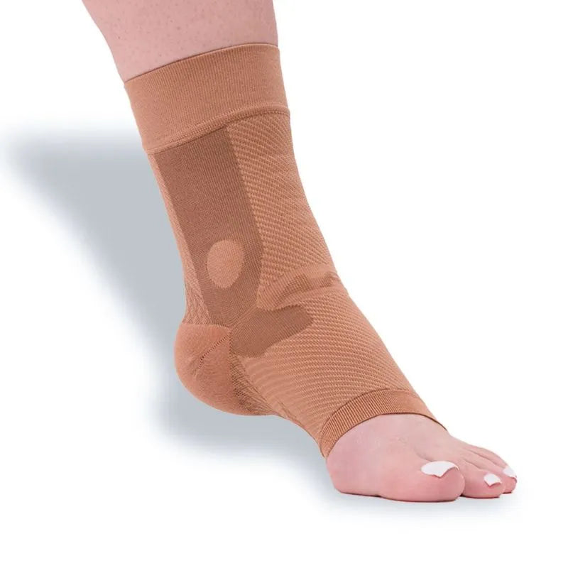 The Tan OrthoSleeve AF7 Compression Ankle Brace shown on a foot