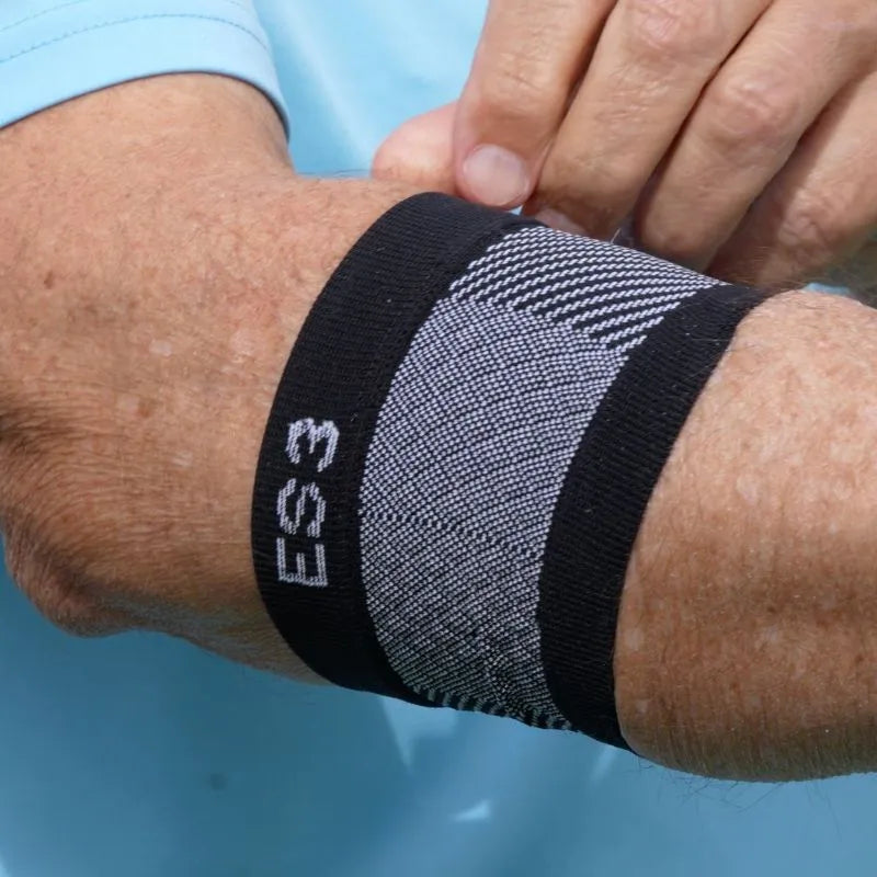 Close up image of a man wearing the OrthoSleeve ES3 Compression Elbow Sleeve