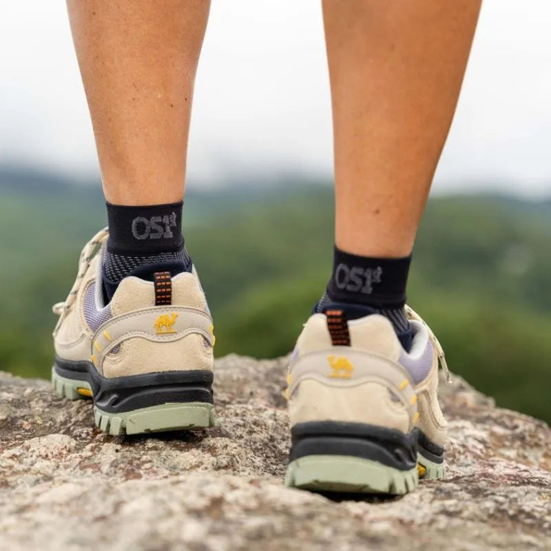 Person wearing the OrthoSleeve Plantar Fasciitis Foot Sleeves while hiking