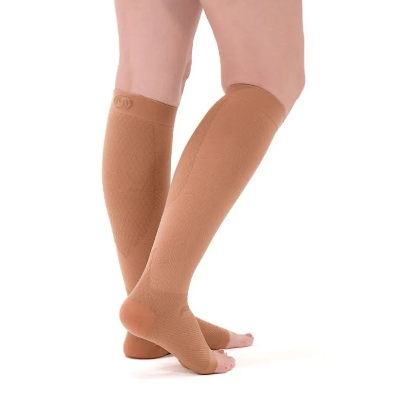 Person wearing the tan OrthoSleeve FS6+ Compression Leg Sleeves for Plantar Fasciitis 