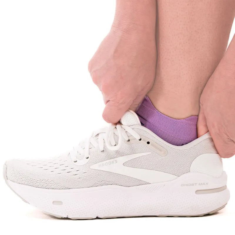 Lifestyle image of a person wearing the no show lavender plantar fasciitis socks