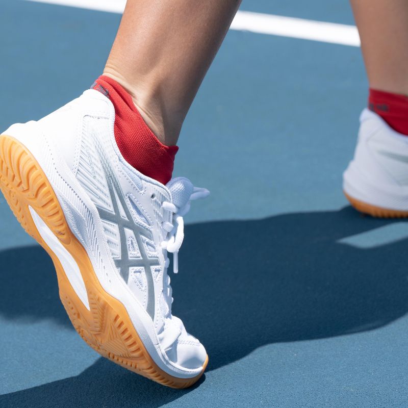 OS1st red Pickleball Socks being worn while playing pickleball