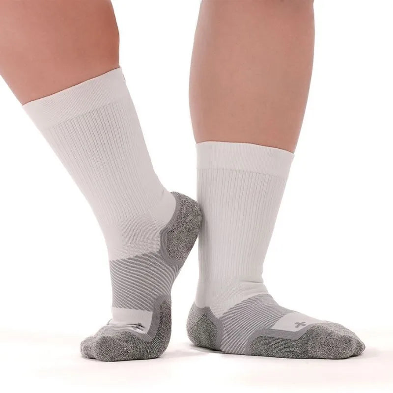 Person wearing the OrthoSleeve Wide Wellness Compression Socks in white crew length