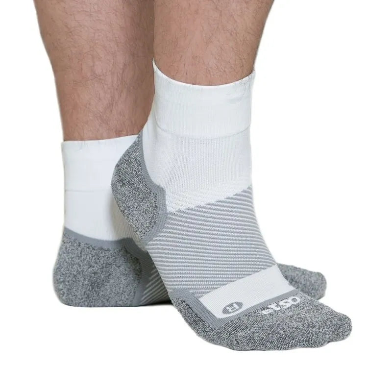 Person wearing the OrthoSleeve Wide Wellness Care socks in white quarter crew length